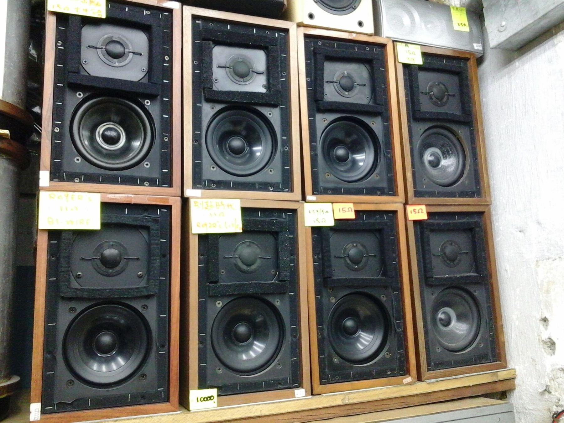 A wall of wooden-framed loudspeakers